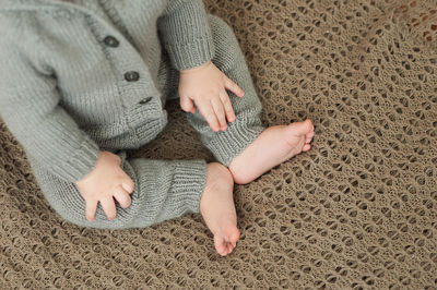 High angle view of baby girl sitting on floor