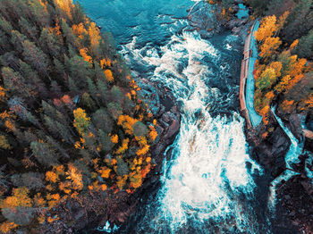 High angle view of water flowing through rocks