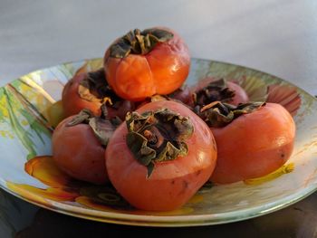 High angle view of tomatoes in plate on table