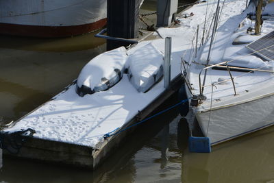 High angle view of sailboats moored in lake