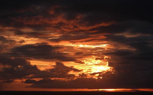 Low angle view of dramatic sky during sunset