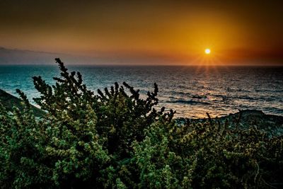 Scenic view of sea against sky during sunset
