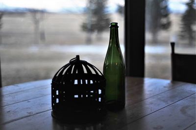 Close-up of glass bottle on table