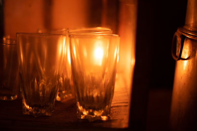 Close-up of wine glasses on table