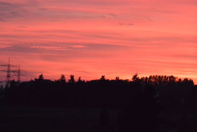 Scenic view of silhouette trees against sky during sunset
