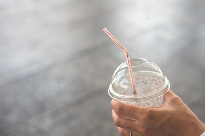 Close-up of hand holding drink
