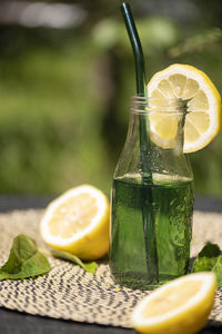 Vertical shot of refreshing chlorophyll drink mixed with lemon