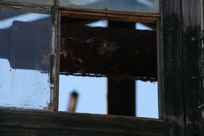 Abandoned building seen through window