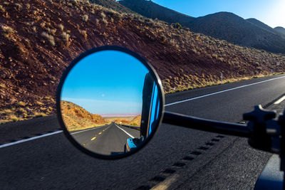 Rearview mirror along the road to the grand canyon national park.