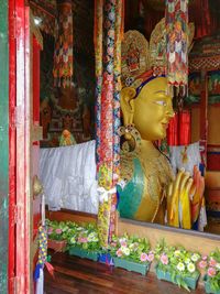 Buddha statue in temple outside building