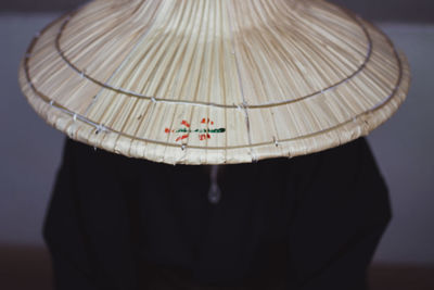 Close-up of woman holding black background