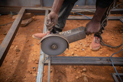 Zambian welder, welding , african man working with his hands 