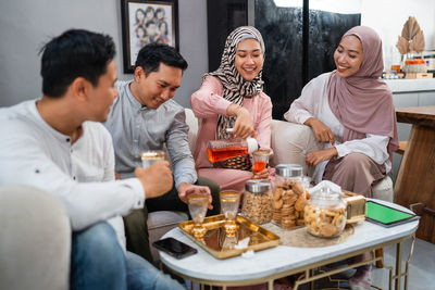 Friends having food at home