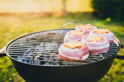 Close-up of meat on barbecue grill in yard