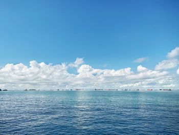 Scenic view of sea against blue sky