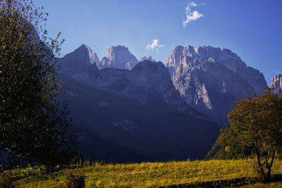 Scenic view of mountains against clear blue sky