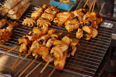 High angle view of meat on barbecue grill