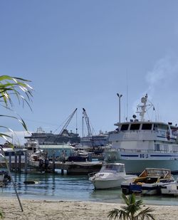 Boats moored at harbor