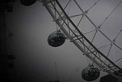 Low angle view of ferris wheel against sky