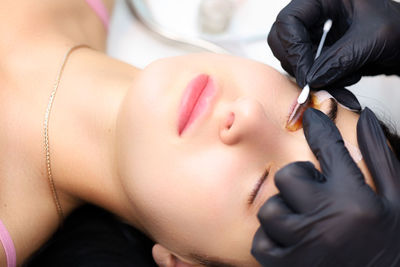 Close-up of young woman lying down