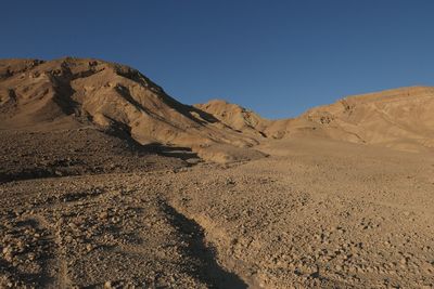 Scenic view of desert against clear sky