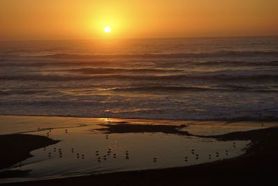 Scenic view of sea against sky during sunset