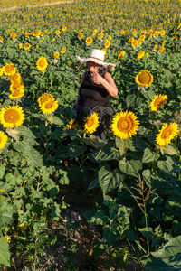 Woman into a sunflower field