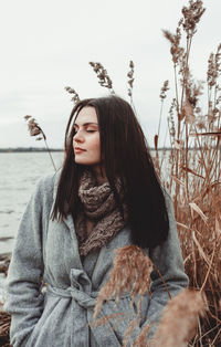 Portrait of young woman looking away