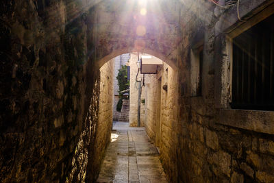 Empty alley amidst buildings