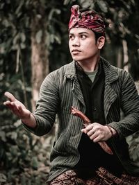 Portrait of young man looking away