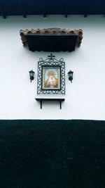 High angle view of clock on table against wall