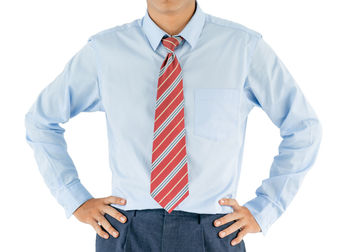 Midsection of man standing against white background