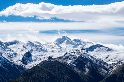 High angle view of snowcapped mountains against sky