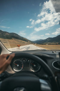 Reflection of man in car mirror