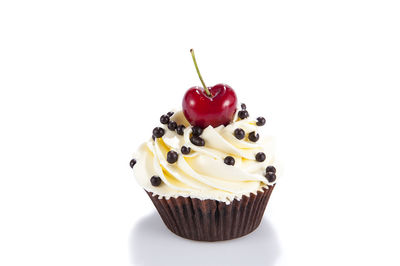 Close-up of cupcakes against white background