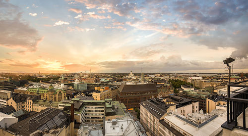 High angle view of cityscape against cloudy sky