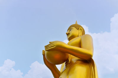 Low angle view of statue against sky