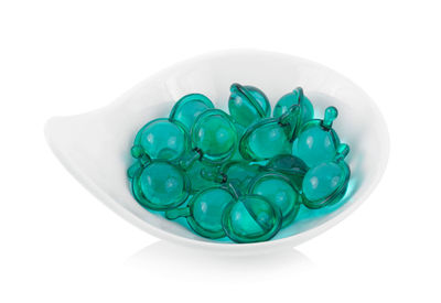 High angle view of green candies on white background