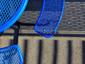 Directly above shot of blue table at sidewalk cafe during sunny day