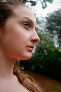 Close-up of young woman in park