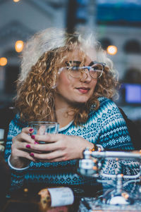 Close-up of young woman drinking coffee