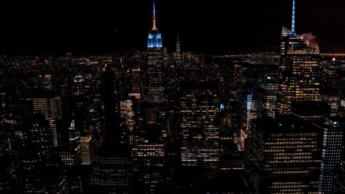 Illuminated buildings in city at night