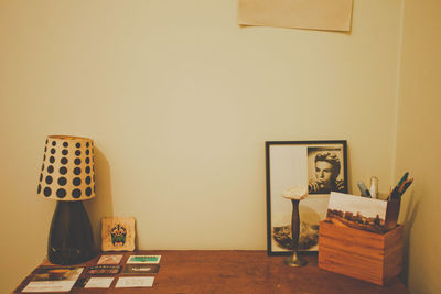 Empty chairs and table against wall at home