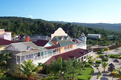 High angle view of houses and trees against clear sky