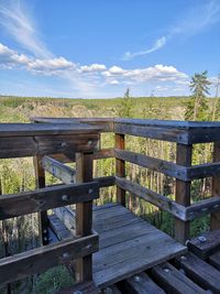Fence on field against sky
