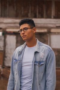 Thoughtful young man standing outdoors