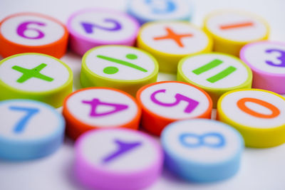 Close-up of multi colored text on table
