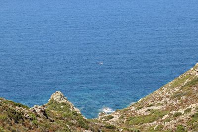 High angle view of rocks by sea
