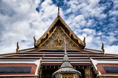 Low angle view of temple building against cloudy sky