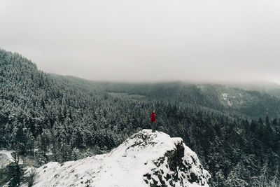 Scenic view of snowcapped mountains against sky during winter